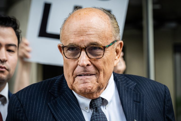 Giuliani’s Bankruptcy Echoes Alex Jones’ Legal Woes: Defamation Debts Linger